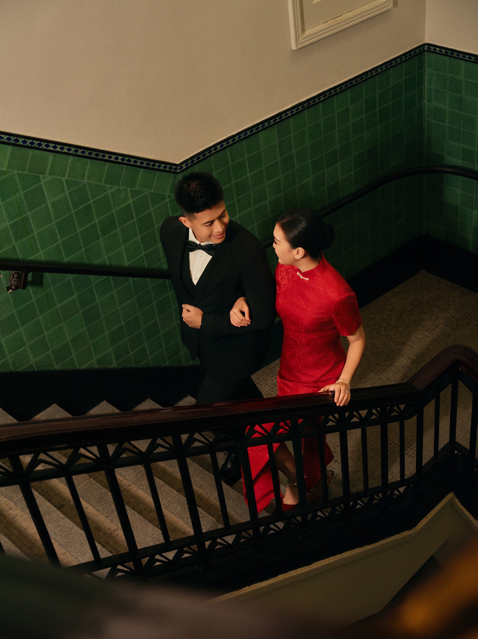 Patrick and Ivy walking together on a staircase